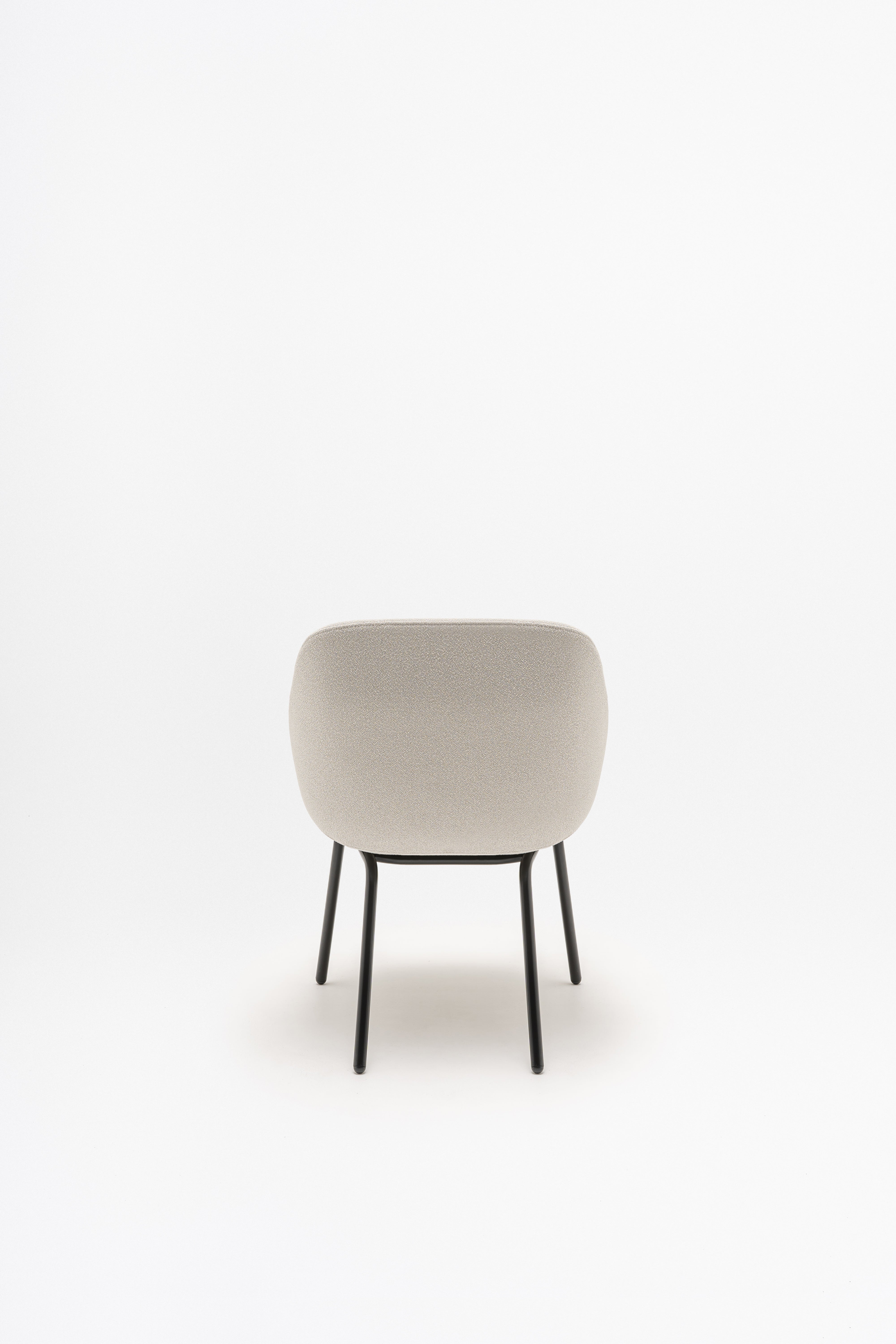 Armchair with low backrest parallel four -legged base