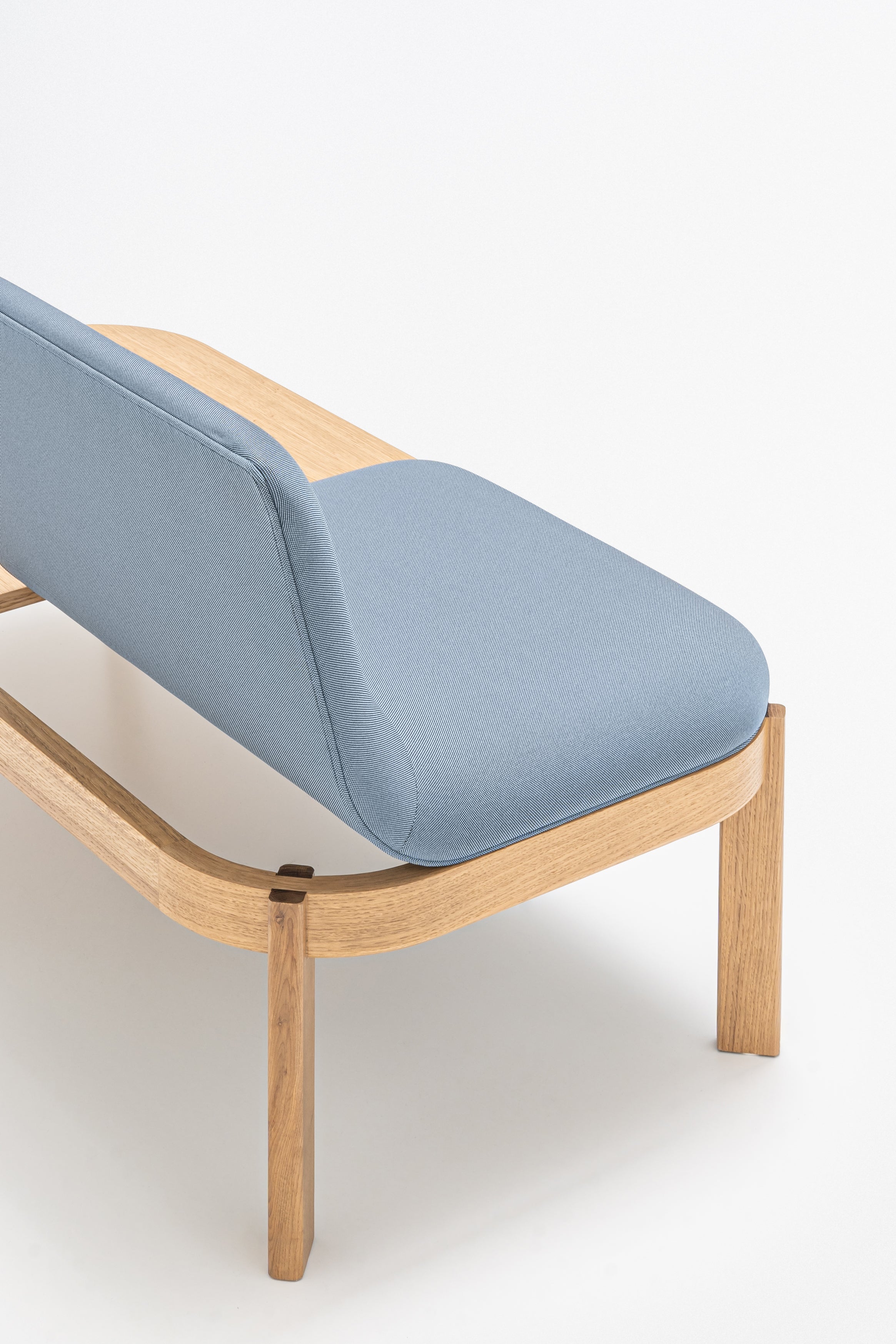 Upholstered bench with ramps of the wooden base