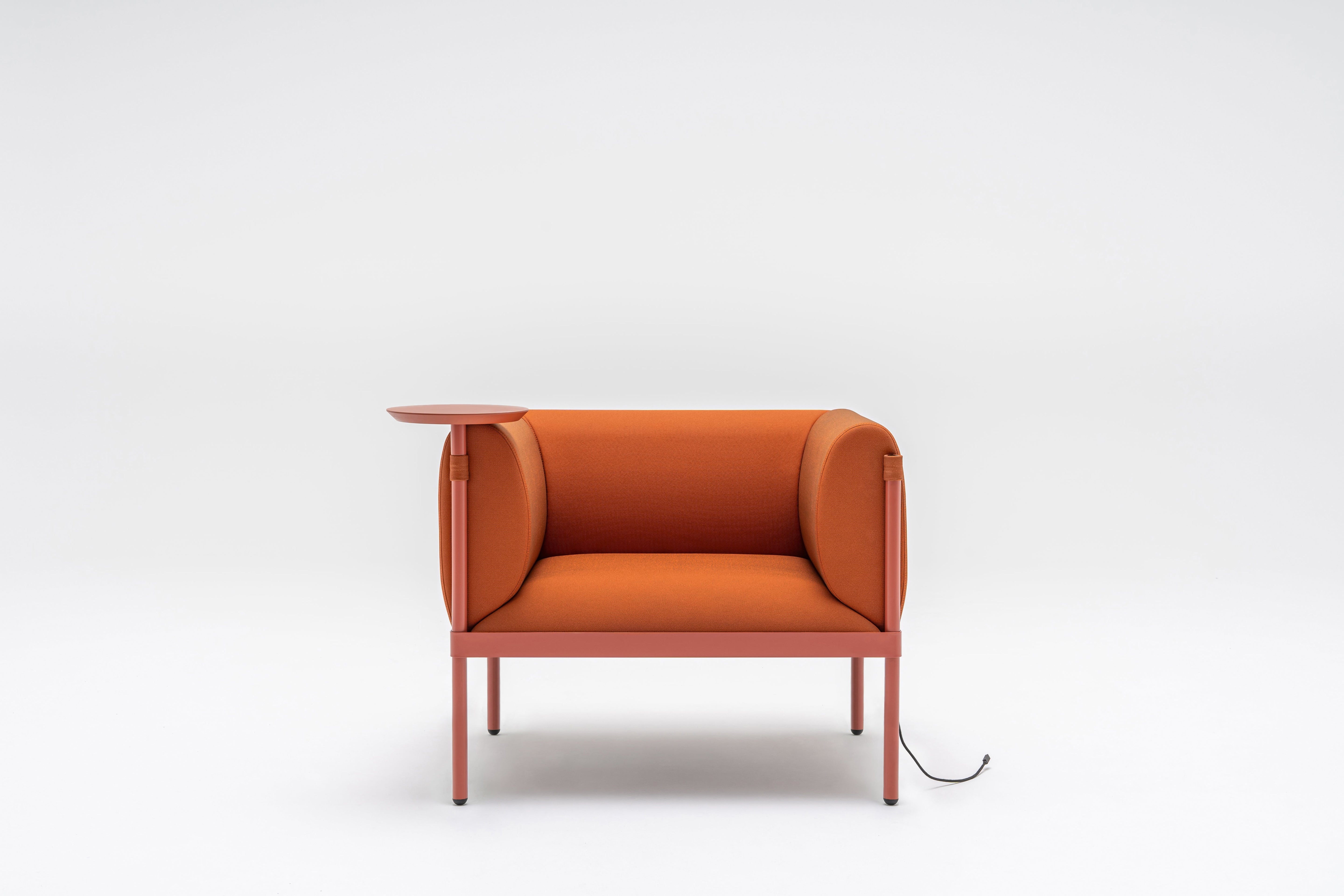 Low upholstered stilt armchair