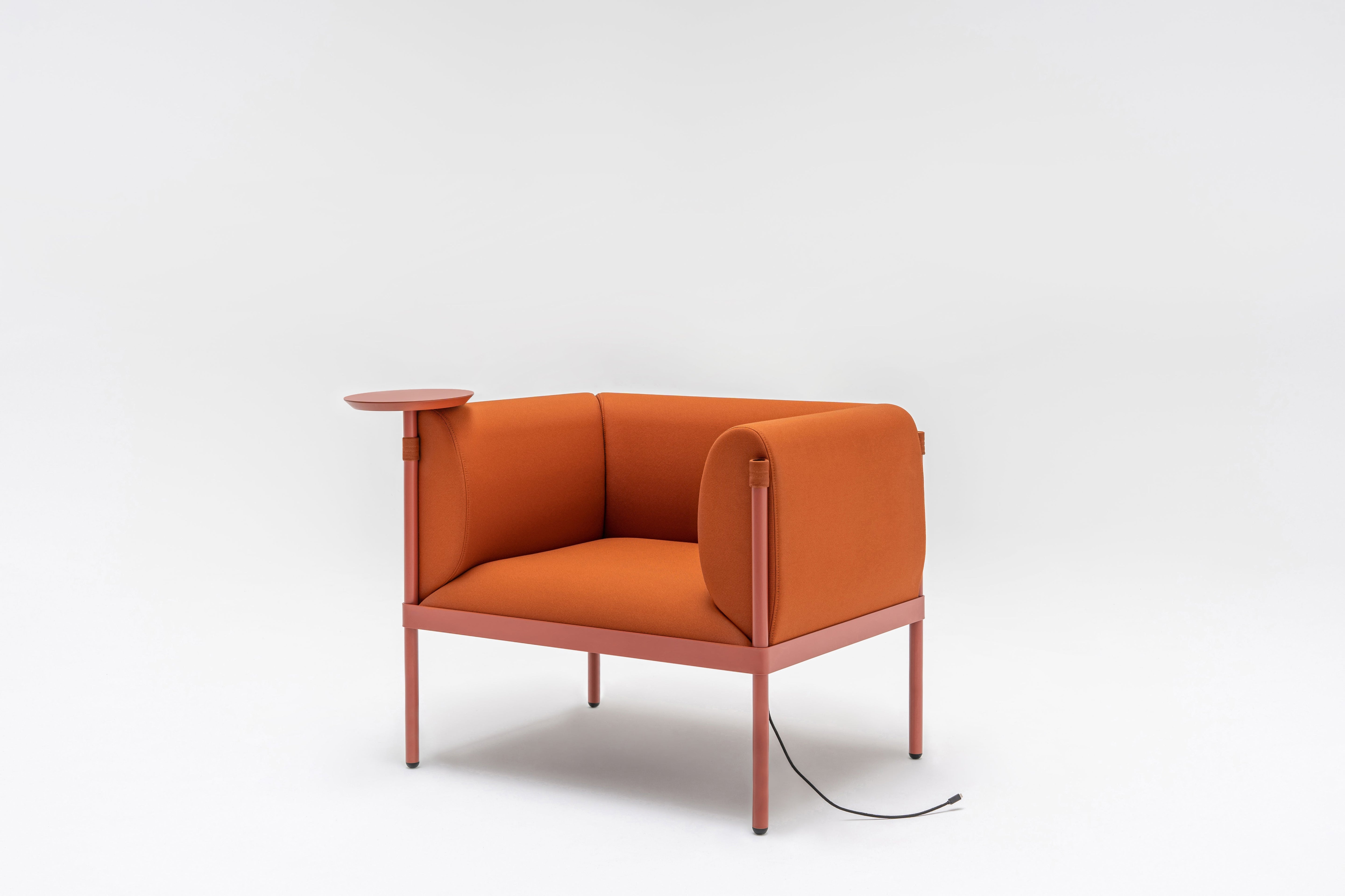 Low upholstered stilt armchair