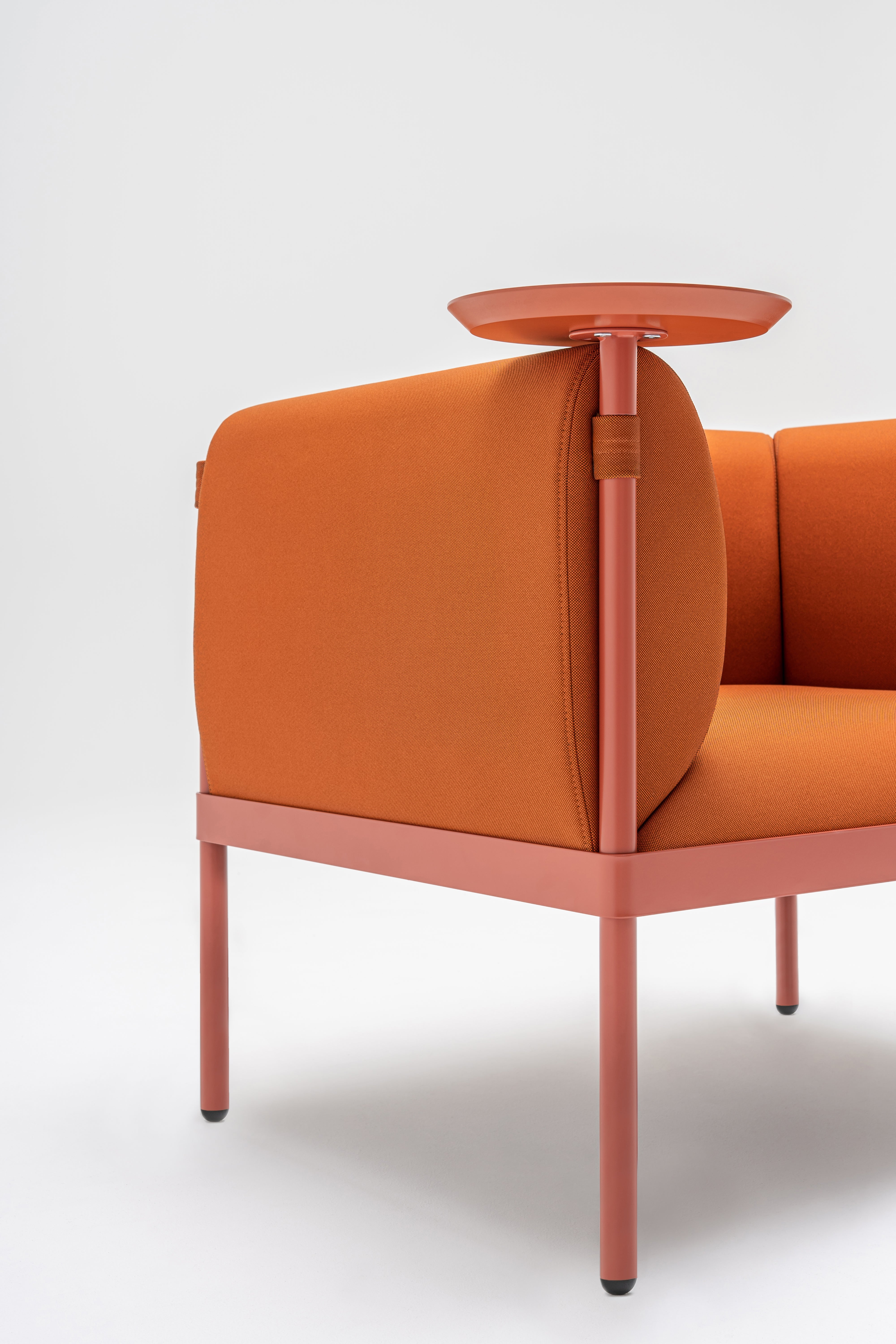 Low upholstered stilt armchair