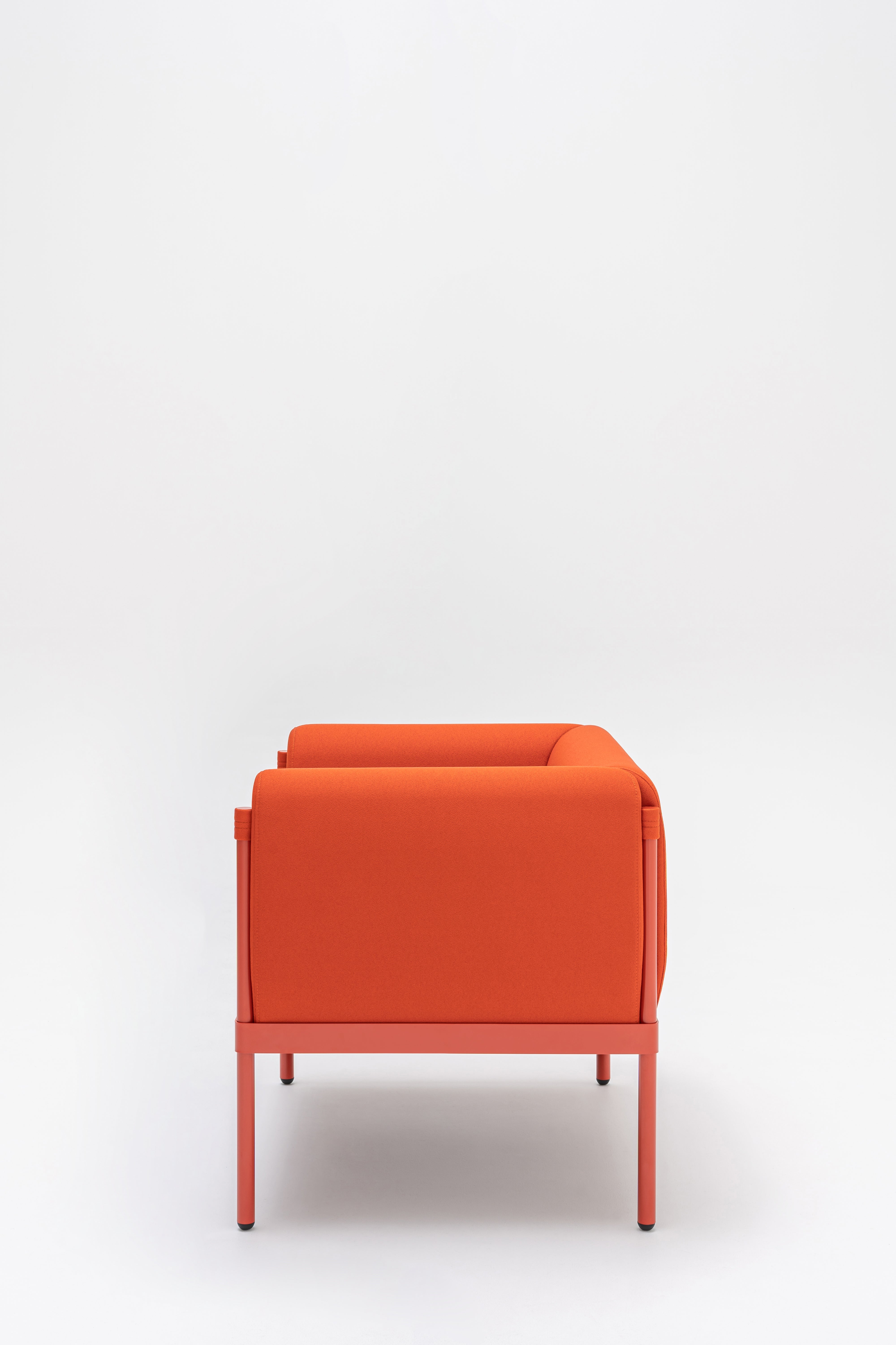 Low upholstered stilt armchair