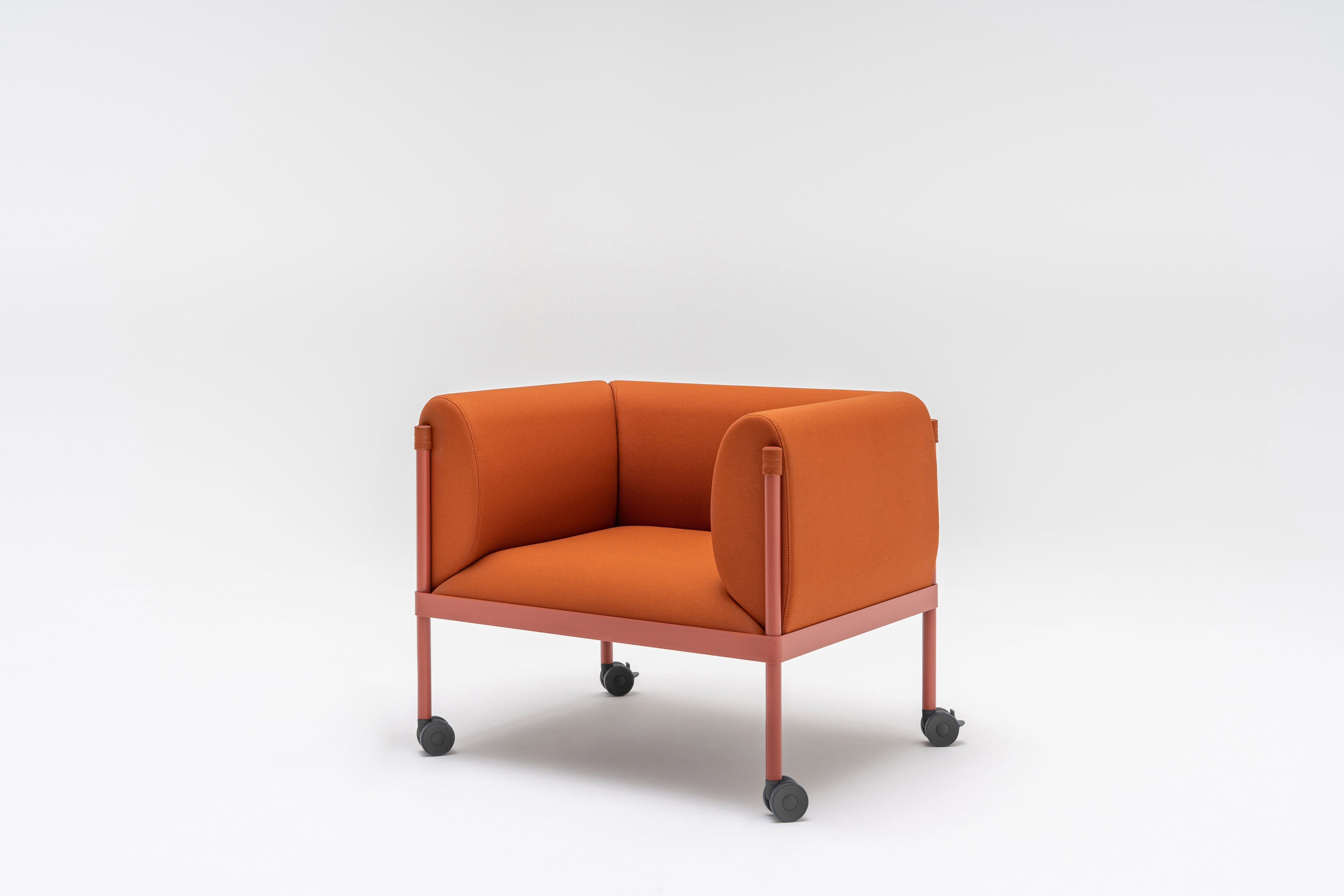 Low upholstered stilt armchair