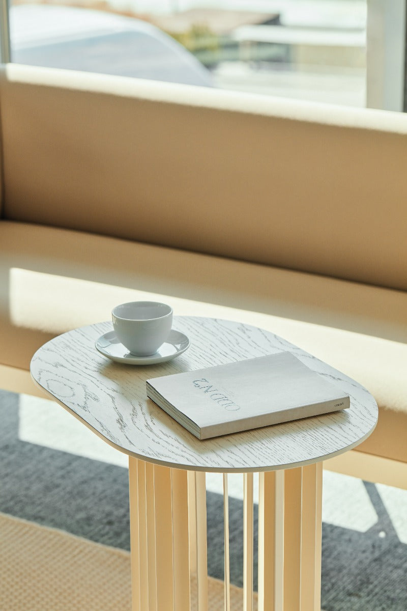 Roll Veneer side table with a metal base