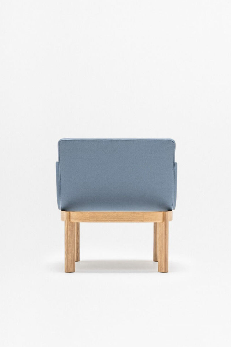 Upholstered chair of the ramp, wooden base